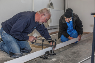 Figure 13 Volunteers building display cases